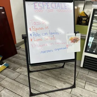 a white board with spanish writing