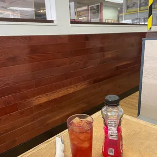 a table with a drink and a shaker