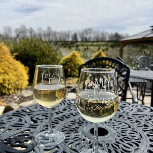 two glasses of wine on a table