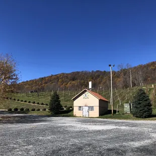 a small building on a hill