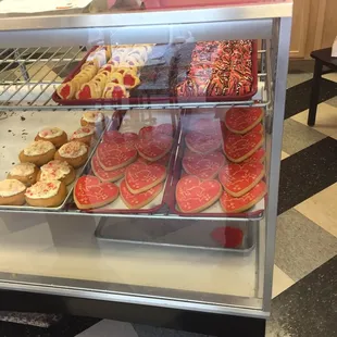 a display case filled with donuts