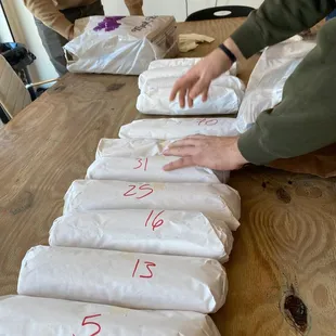 a man and a woman setting up a table