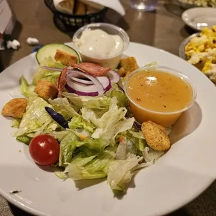 Side salad with ranch and Italian dressings.
