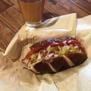 Beef frank with Siracha, onions, tomatoes and peppers