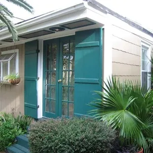 one of the rooms that opens into the backyard/pool area
