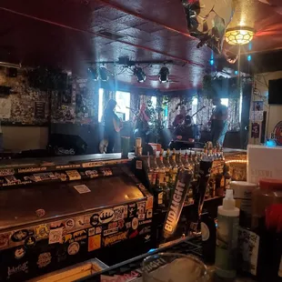 a bar with a lot of bottles of beer