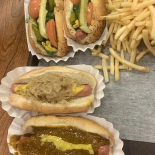 Two Chicago's, New York and Detroit style dogs