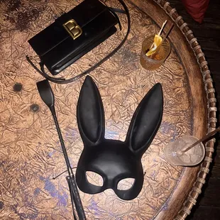 a bunny mask and a knife on a table