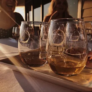 three glasses of wine on a tray