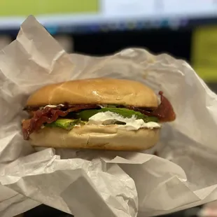 Bagel, cream cheese, bacon, avocado.