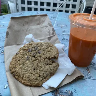 a cookie and a drink on a table