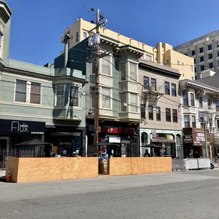 a row of buildings on a city street