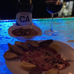 Beef carpaccio and cheesy meatballs