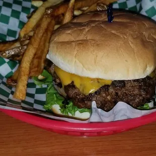 Cheddar cheese burger with fries.