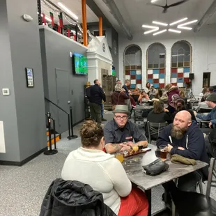 a group of people sitting at a table