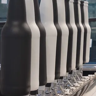 a row of bottles on a conveyor belt