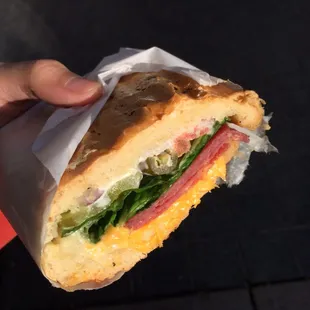 Salami sandwich on soft roll with American cheese and everything on it except mustard toasted on the waffle iron