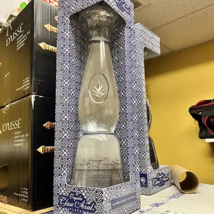 a glass bottle in a box