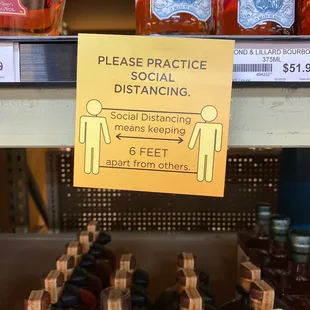a sign stating social distancing