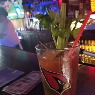 a drink with a garnish garnish
