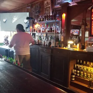 a woman behind the bar