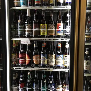 a refrigerator full of beer bottles