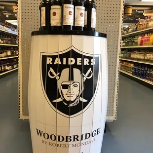the oakland raiders logo on a wooden barrel