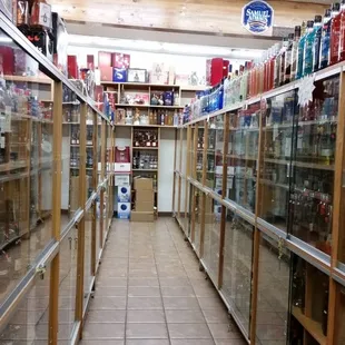 a long narrow aisle in a liquor store