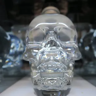 a glass skull in a display case