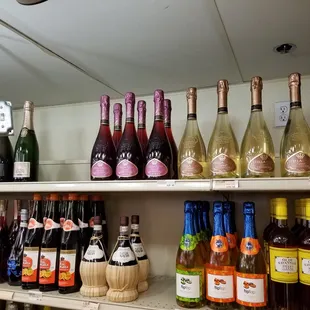 a shelf full of wine bottles