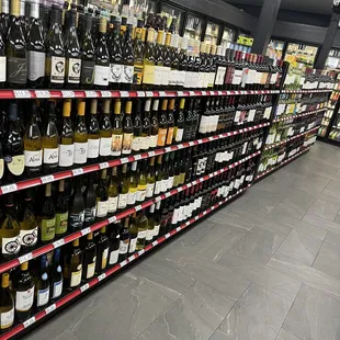 rows of bottles of wine on shelves