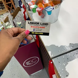 a person holding a business card