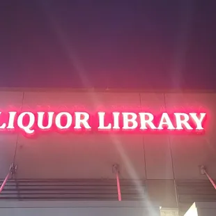 a neon sign for liquor library