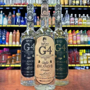 three bottles of liquor in a liquor store