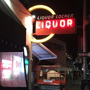 Fixing sign outside.