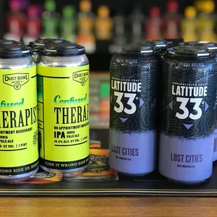 three cans of beer on a table