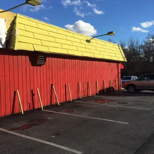 a red building with a yellow roof