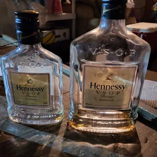two bottles of liquor on a table