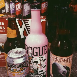 a variety of beer bottles and cans