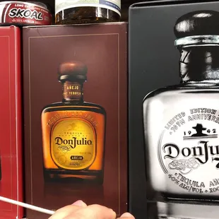 a bottle of don julio tequila on display