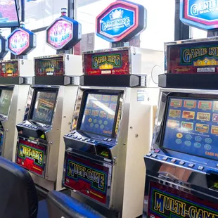 a row of slot machines in a liquor shop