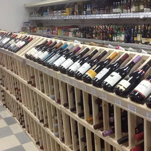 rows of bottles of wine on shelves