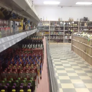 rows of liquor bottles in a store