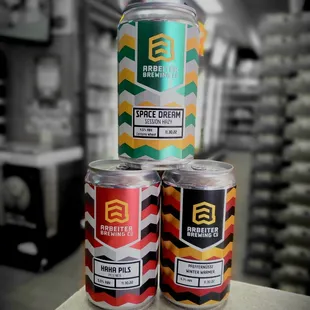 three cans of beer on a counter