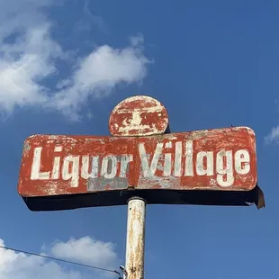 a sign for liquor village