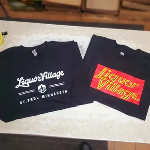 two t - shirts on a counter