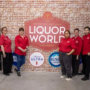 a group of people in red shirts