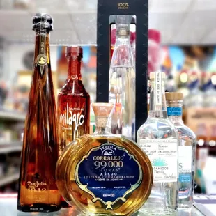 a variety of liquor bottles on a table