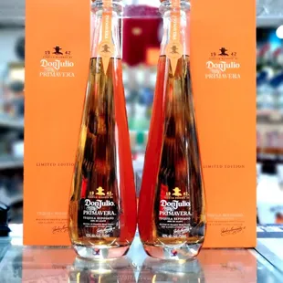 two bottles of liquor on a table