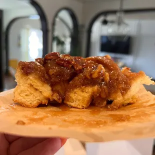 a hand holding a pastry